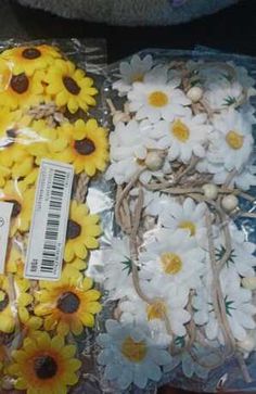 sunflowers and other flowers are wrapped in plastic