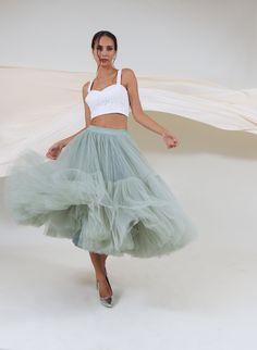 FREE FEDEX DELIVERY INCLUDED! PHONE NUMBER REQUIRED!! Very fluffy tiered skirt is made of soft tulle. This skirt does not add volume to the waist and hips. The entire volume is gathered towards the lower edge: the bottom row layers (together) measure 63m (207ft) of tulle fabric. Pictured skirt is 79cm (31 inches) long, color number 97; it features all-round stretching waistband which stretches very well covering wide variety of waist sizes. All the skirt's features can be varied on demand - do w Cheap Fitted Tulle Skirt, Luxury Ruffled Skirt For Party, Cheap Ruffled Skirt For Wedding, Luxury Ruffled Voluminous Skirt Bottoms, Tulle Skirt Ou, Layered Tulle Skirt Gown, Cheap Summer Tulle Skirt, Layered Tulle Skirt Midi, Luxury Ruffled Skirt For Wedding