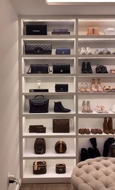 a white closet filled with lots of shoes and handbags next to a shelf full of purses