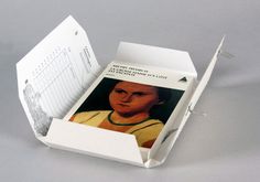 an open box containing a photo of a woman's face and name on it