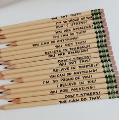 there are many pencils with writing on them