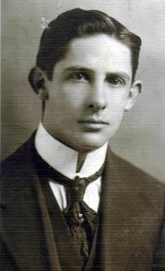 an old photo of a man wearing a suit and tie