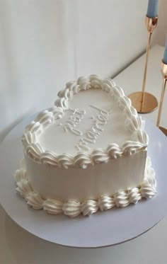 a heart shaped cake sitting on top of a table