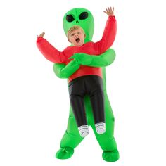 a young boy in an inflatable costume