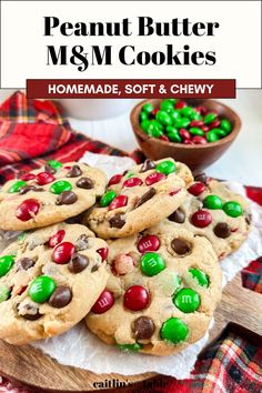 homemade peanut butter m & m cookies on a wooden platter with green and red candies