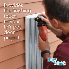 a man is using a drill to fix a window sealer on the side of a house