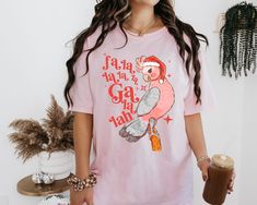 Cute Australian Galah Bird Falala Christmas Shirt, Funny Christmas women's shirt, Pink Girly Christmas gift for ladies 🎁 THE PERFECT GIFT FOR EVERYONE YOU LOVE 🎁 Surprise your friends, family, and loved ones with affordable, high-quality, personalized t-shirts. Each shirt is carefully hand-printed using the latest technology and eco-friendly, water-based inks. Thank you for choosing us! 💖 FINDING YOUR PERFECT SIZE 💖 Please refer to the size chart in the photos. We offer measurements for different clothing types and sizes. These shirts are unisex, so if you order your usual women's size, expect a looser fit. Note that the size chart measurements are not circumference. Clothing brands may vary depending on stock availability. 🛒 HOW TO ORDER 🛒 Carefully read all the information provided Pink Girly Christmas, Galah Bird, Girly Christmas Gifts, Girly Christmas, Christmas Shirt Funny, Clothing Brands, Latest Technology, Christmas Women, Funny Christmas