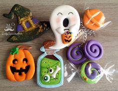 halloween treats are arranged on a table with candy in the shape of jack - o'- lanterns