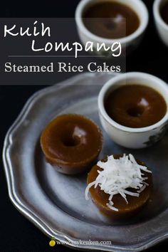 three small white bowls filled with caramel and chocolate covered doughnuts on a silver plate