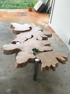 a wooden bench made out of tree trunks