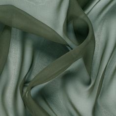 Mood's Premium Olive Green Silk Wide Chiffon is a sheer, lightweight and ethereal fabric. An excellent choice for fluid, top-weight garments, overlays, flowing scarves, and sheer insets such as ruffle details and draped extensions. Available in 95+ attractive shades. 

Note: Dye lots are subject to change up to 10% in either direction. Ordering swatches is HIGHLY recommended for these products. Mood Fabrics, Olive Green Color, Georgette Fabric, Gorgeous Fabrics, Green Silk, Blouse Fabric, Green Aesthetic, Fabric Online, Fashion Fabric