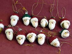 christmas ornaments are arranged on a red surface with twine and string attached to them