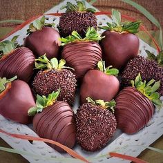 chocolate covered strawberries and other desserts on display