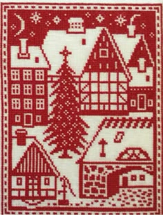 a red and white cross - stitch pattern with houses, trees and snowflakes