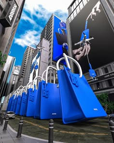 a bunch of blue bags sitting on the side of a road next to tall buildings