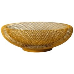 a yellow bowl sitting on top of a wooden table