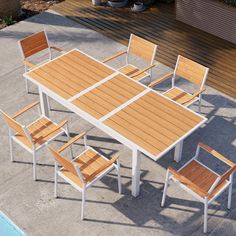 an outdoor dining table with six chairs next to a swimming pool and wooden decking