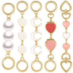 six different key chains with charms on them