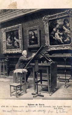 an old black and white photo of a man working in a room with paintings on the walls