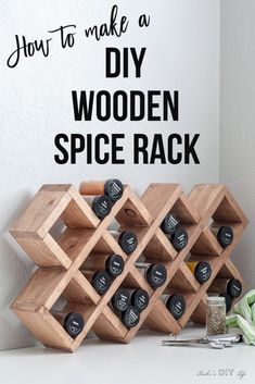 a wooden spice rack sitting on top of a white counter next to a wall with the words how to make a diy wooden spice rack