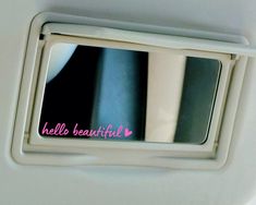 there is a mirror with the words hello beautiful written on it and pink writing underneath