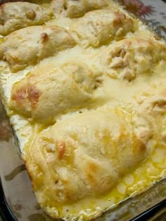 a casserole dish filled with cheese and meat