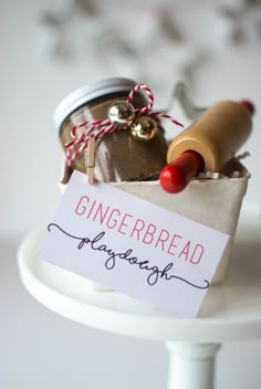 a gingerbread doughnut in a jar with a sign on it