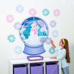 This frosty scene features pastel-colored snowflake cutouts and a snow globe with an image of a smiling snowman dressed in a colorful scarf and earmuffs. This classroom decoration will add a touch of outdoor, snowy fun to the indoors during wintertime. Cardstock. (13 pcs., 5 sheets per unit) Sheets, 16" x 24 1/2". Simple assembly required. © OTC Wall Statement Piece, Heart Shaped Crayons, Wall Statement, Snowman Dress, Snowflake Cutouts, Crayon Set, Teaching Supplies, Crayon Box, Coloring Supplies