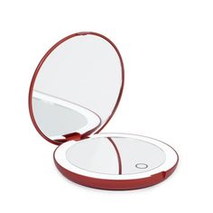 the compact mirror is red and white with a circular lid on it's side