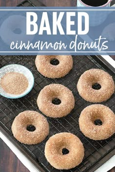 baked cinnamon donuts on a cooling rack with coffee