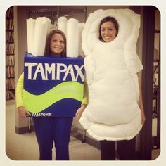 two girls dressed in costumes standing next to each other and holding giant pillows with the words tampa written on them