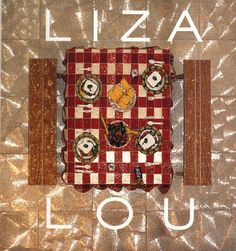 a red and white checkered table cloth with the words pizza louu on it