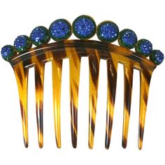 Art Deco Pave Ball Comb form the 1920's. Graduated half spheres are pave set with emerald and sapphire paste stones on top of a faux tortoiseshell comb. 1920's USA. 5" x 4" high. Excellent condition. Tortoise Shell Jewelry, Antique Hair Combs, Gold Fox, Art Deco Hair, Victorian Hairstyles, Vintage Hair Combs, Brown Jewelry, Green Hats, Charm Set