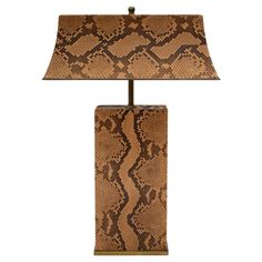 Stunning and rare "Pagoda Lamp" in brown and black python with bronze base, trim, shade interior and lighting assembly by Karl Springer, American 1970's. Because the inside of the shade is bronze, it gives off a beautiful light. Bottom of lamp is covered in felt. The craftsmanship and design of this lamp are superb. This lamp has been rewired by Lobel Modern. Reference: Lobel Modern Archive - a Pagoda Lamp was professionally photographed by Karl Springer LTD for marketing material in the 1970’s. Pagoda Lamp, Black Python, Base Trim, Beautiful Lights, Table Lamp Lighting, Python, 1970s, Table Lamp, Felt