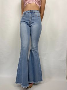 Bia Bell Bottom Jeans Jeans are true to size! Oversized (extremely long) Size runs small Wide leg Back pockets Stretchy Unfinished hem High waisted Belt loops on waist Model is 5'7 wearing a size 7 Fabric: 60%Cotton, 32%Modal, 7%T400, 1%Lycra Baggy Full-length Flare Jeans In Medium Wash, High Rise Solid Bottoms For Spring, High Waist Solid Bottoms For Spring, Solid High Rise Bottoms For Spring, Solid High Waist Bottoms For Spring, Solid Color High Rise Bottoms For Spring, Solid Color High Waist Bottoms For Spring, Spring Solid High Rise Bottoms, Spring Solid Color High Rise Bottoms