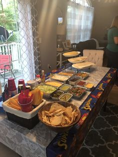 a table filled with lots of food and condiments