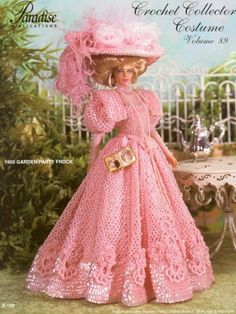 a barbie doll wearing a pink dress and hat