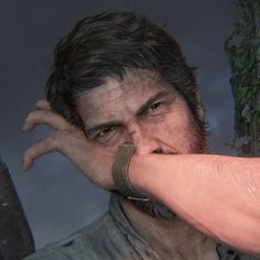 a close up of a person touching the hand of another person's face with both hands