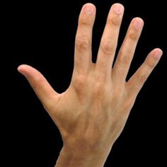 a person's hand reaching out towards the camera