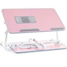 a pink computer desk with a mouse and keyboard on it's side, in front of a white background