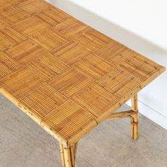 a table made out of bamboo sitting on the floor