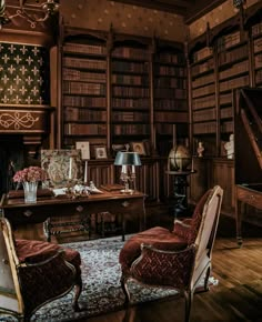 an old fashioned library with two chairs and a piano