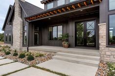 a house with stone steps leading up to the front door