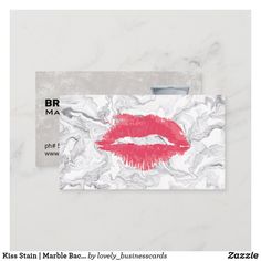 a business card with a marble background and red lipstick on the front, which reads br ma