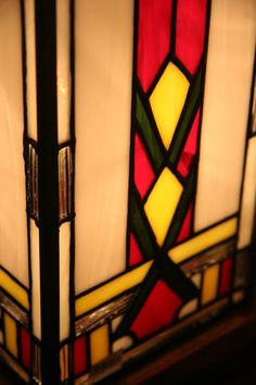 a stained glass lamp is shown in the dark