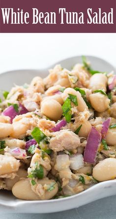 white bean tuna salad in a bowl on a table with text overlay that reads, white bean tuna salad