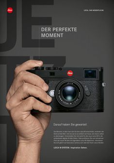 a person holding up a camera in front of a black and white background with the words'the perfect moment '