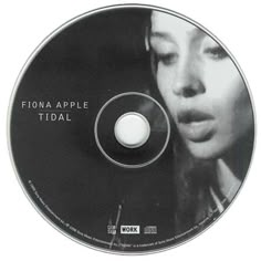 a black and white photo of a woman's face on a cd disc that reads fionna apple tidal