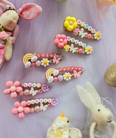 there are many different hair clips on the table with some bunny ears and other items