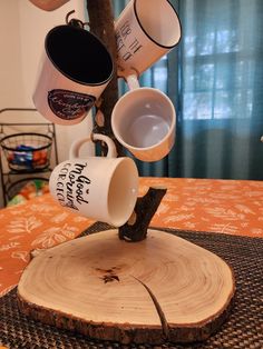 coffee mugs are stacked on top of each other in the shape of a tree